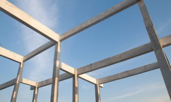 Structure of concrete for building construction on blue sky background. Minimal