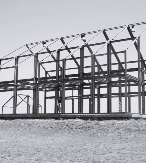 low-angle-view-steel-construction-field-against-clear-sky